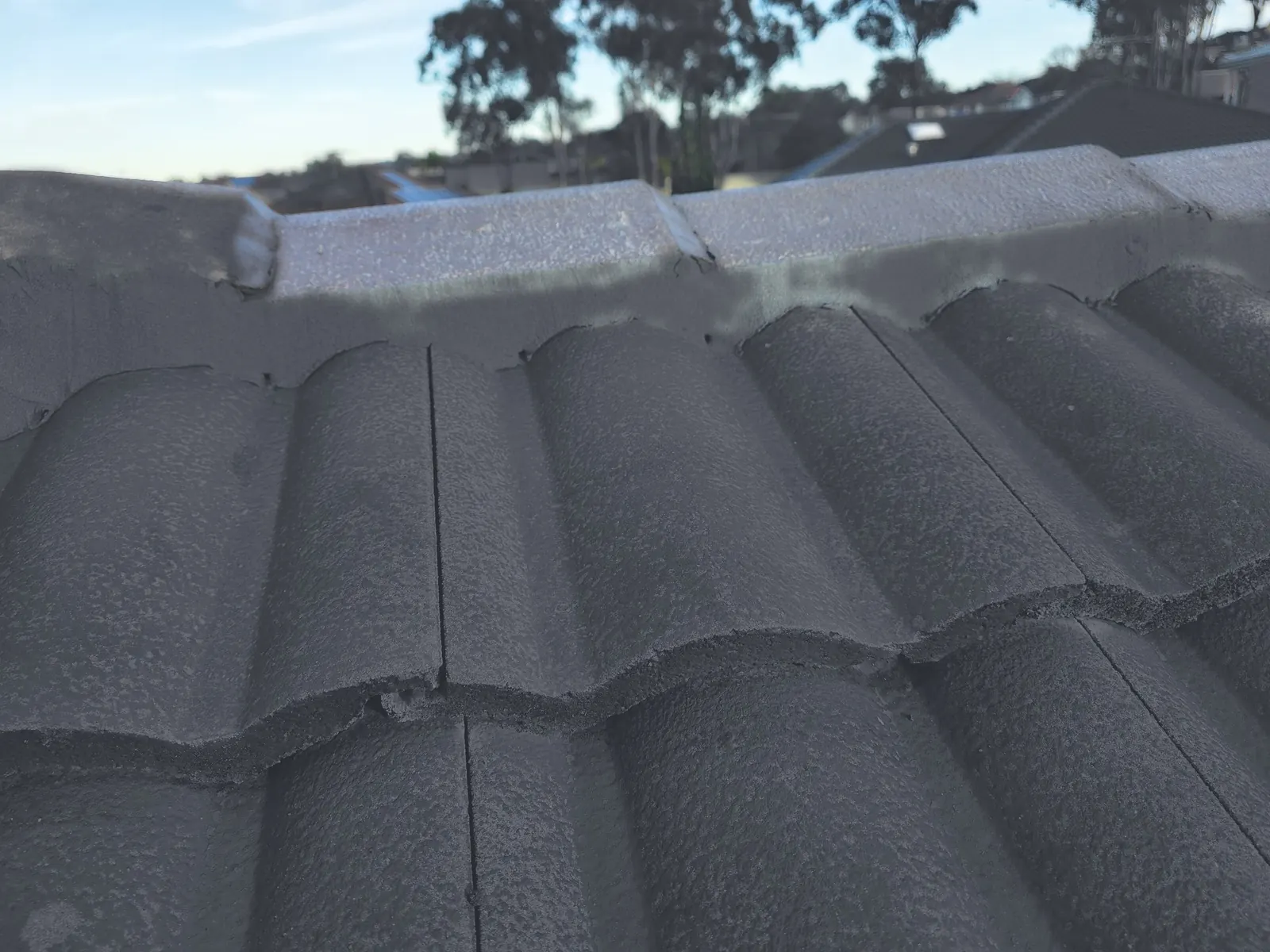 Recoated tiles with fresh ridge pointing