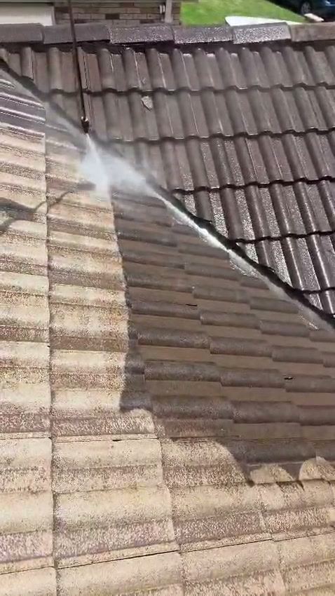 High pressure cleaning in action stripping grime from a surface